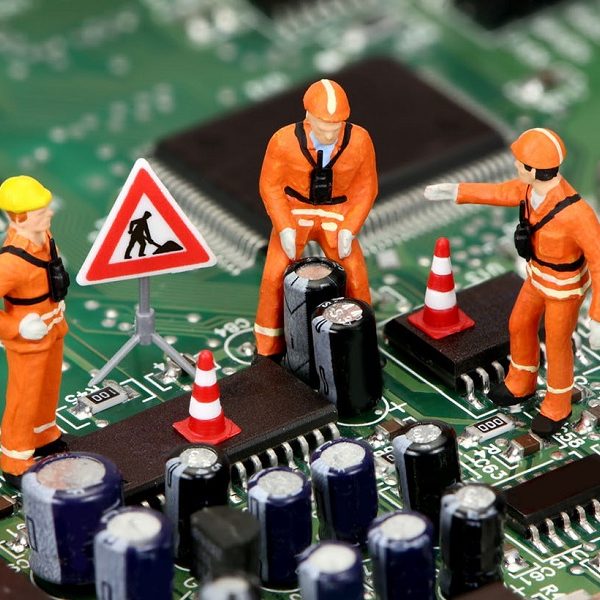 technicians working on electronics or motherboard